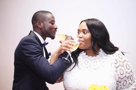 Bride and Groom Sipping Champagne